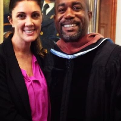 Beth Leonard is wearing a pink top with black coat and Darius Rucker is wearing a black cloth.